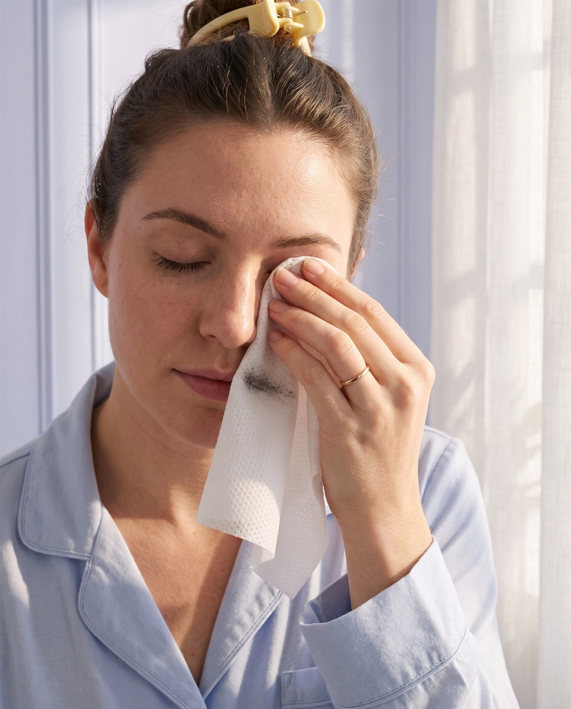 Removing eye makeup with a cotton face towel